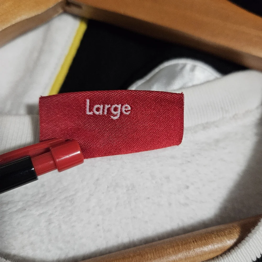 Supreme White Crewneck Sweatshirt with Black and Yellow Stripe